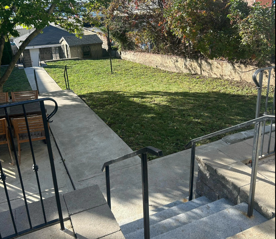 East Boston backyard cleanup with granite steps and restored lawn